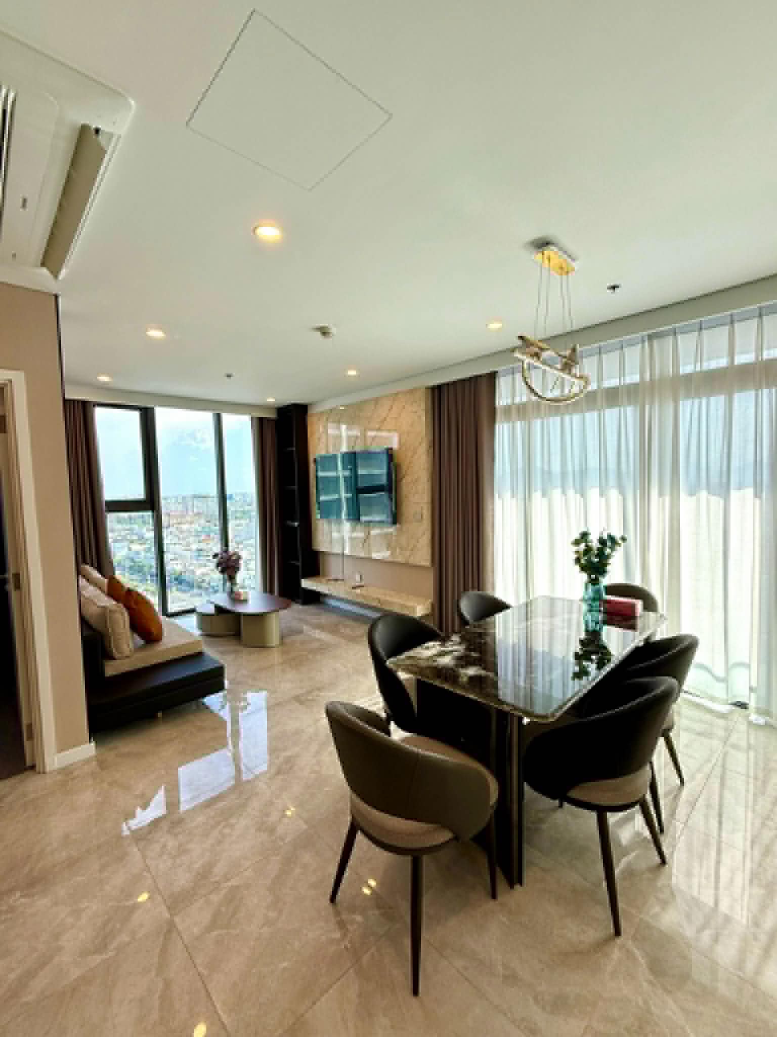 Cozy living room with beige sofa and TV
